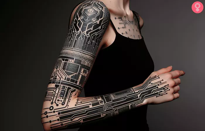 A woman with a cyberpunk tattoo on full arm