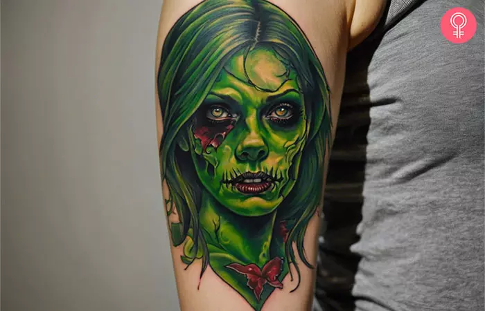 A woman with a female zombie tattoo on her upper arm