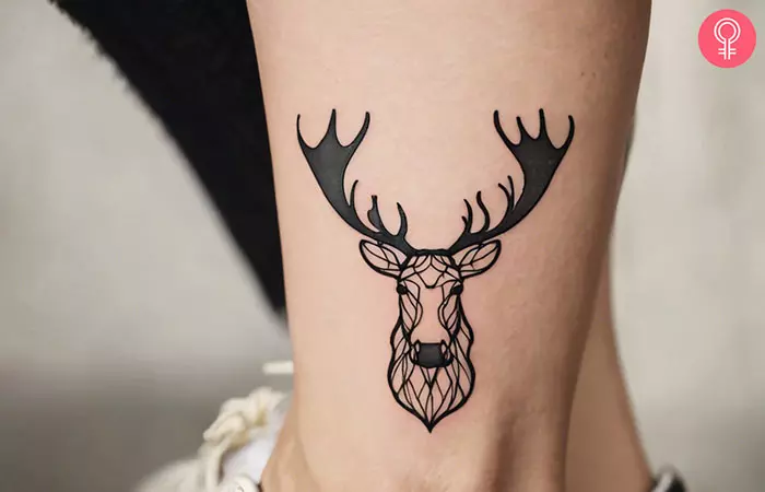 A woman with a feminine small moose tattoo