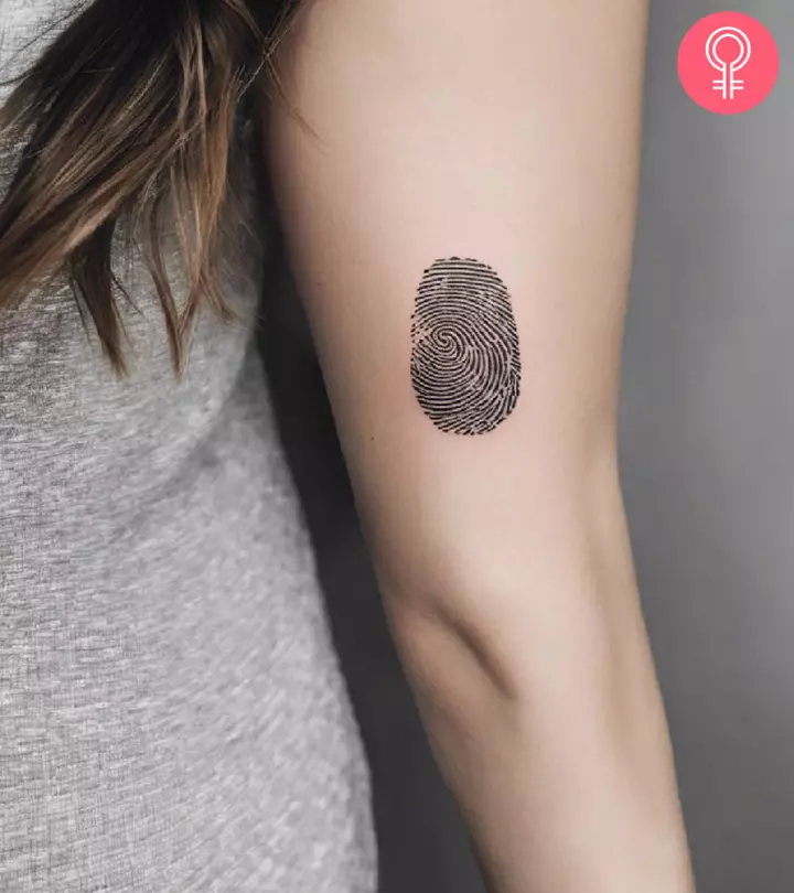 A woman with a fingerprint tattoo on her arm