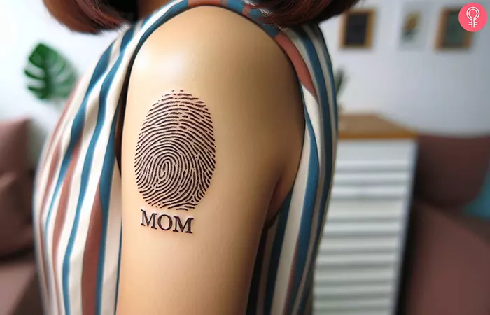 A woman with a fingerprint tattoo on her upper arm