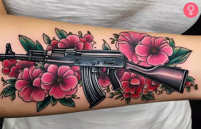 A woman with a girly AK-47 gun tattoo on her arm