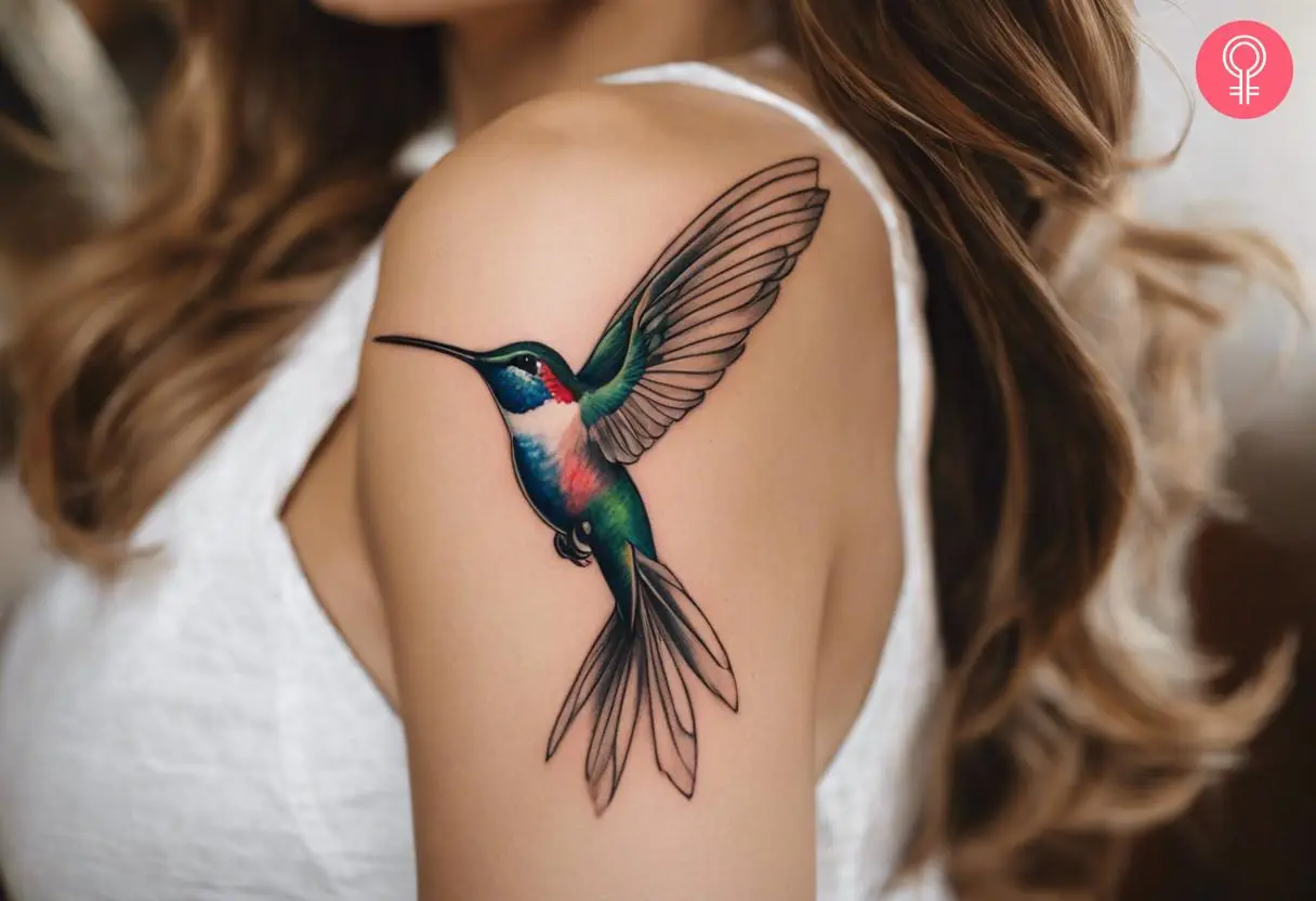 A woman with a hummingbird drawing tattoo on her shoulder