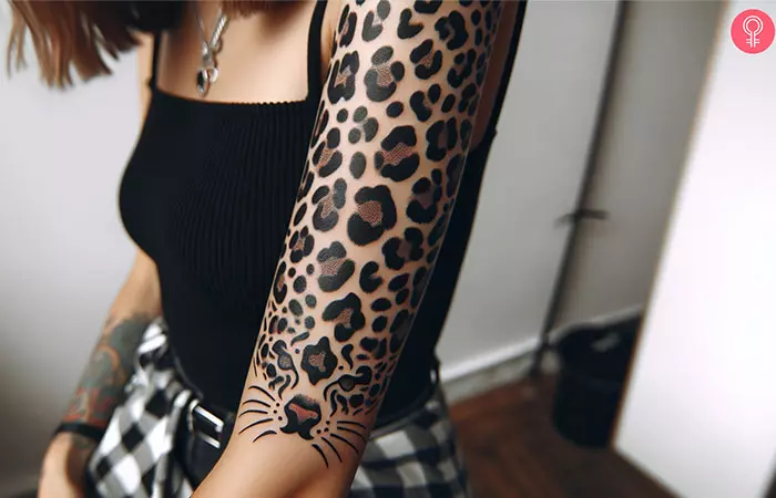A woman with a leopard print arm tattoo
