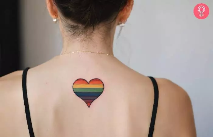 A woman with a lesbian pride tattoo on her back