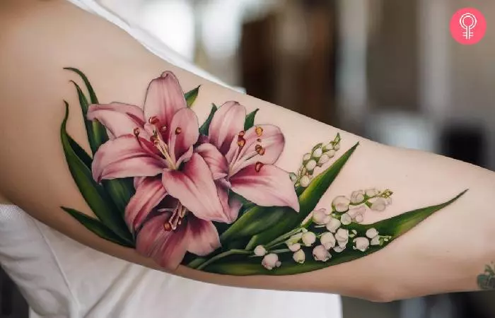 A woman with a lily of the valley and gladiolus tattoo