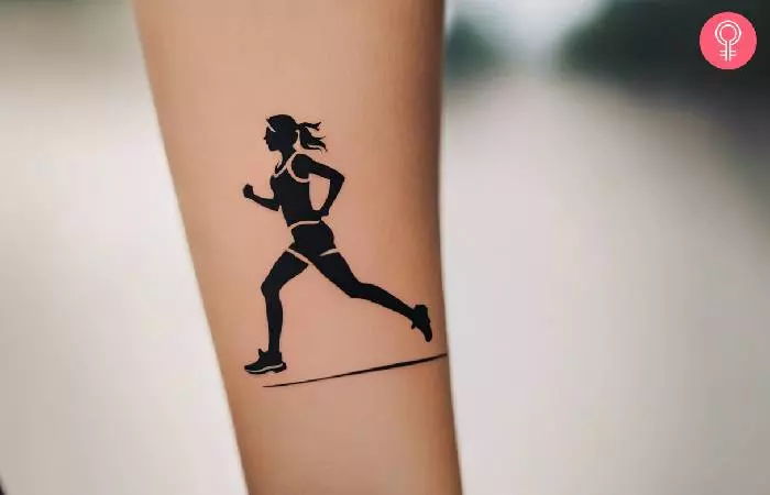 A woman with a marathon runner tattoo on her forearm