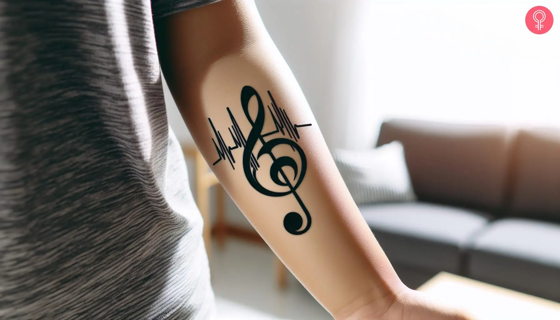 A woman with a musical heartbeat tattoo on her forearm