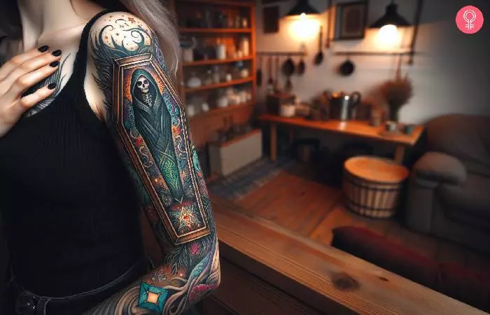 A woman with a mystical coffin tattoo on her upper arm