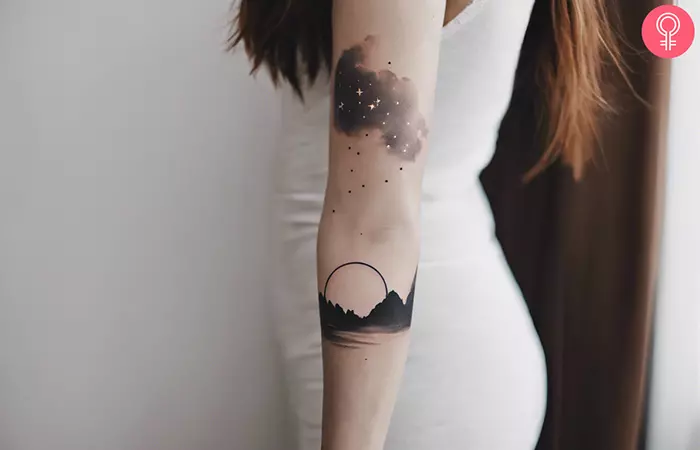 A woman with a night sky sleeve tattoo