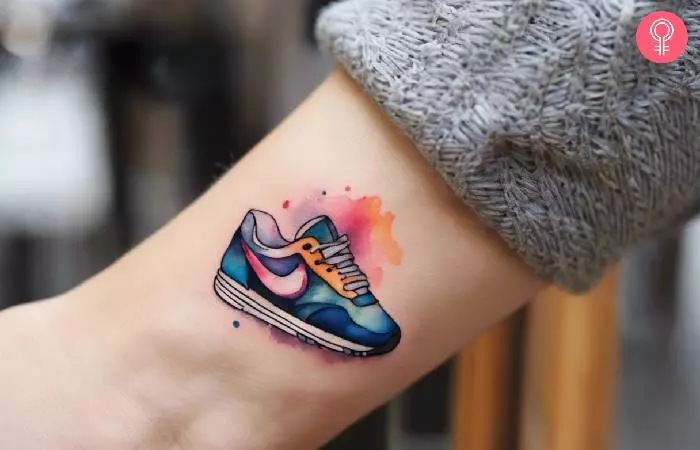 A woman with a running shoe tattoo on her wrist