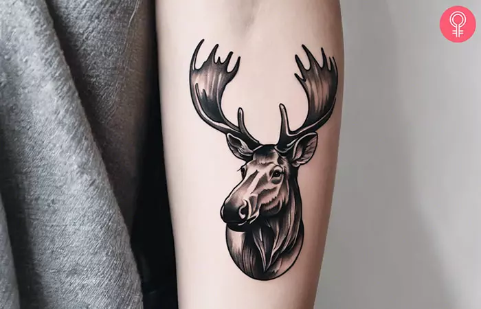 A woman with a simple moose tattoo on her wrist