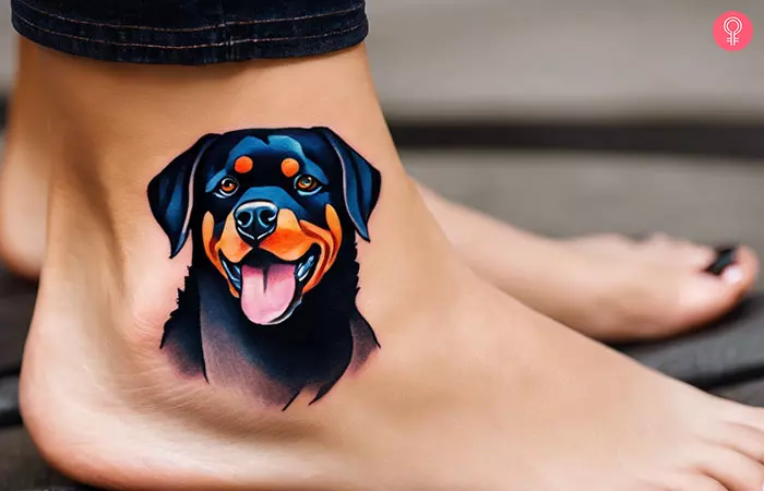 A woman with a simple rottweiler tattoo on her ankle