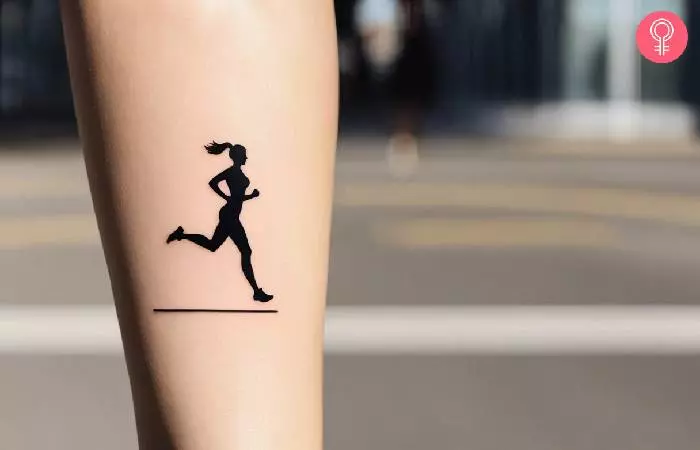 A woman with a small running tattoo on her leg