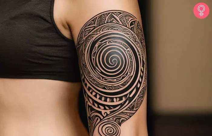 A woman with a spiral tattoo in Maori style