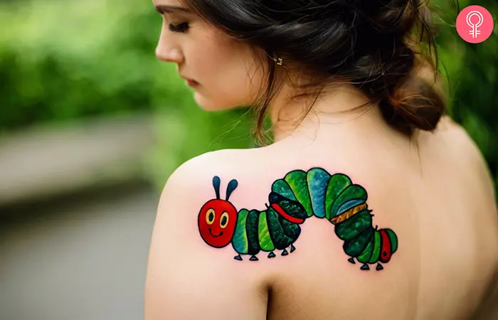 A woman with a tattoo of a very hungry caterpillar on her back