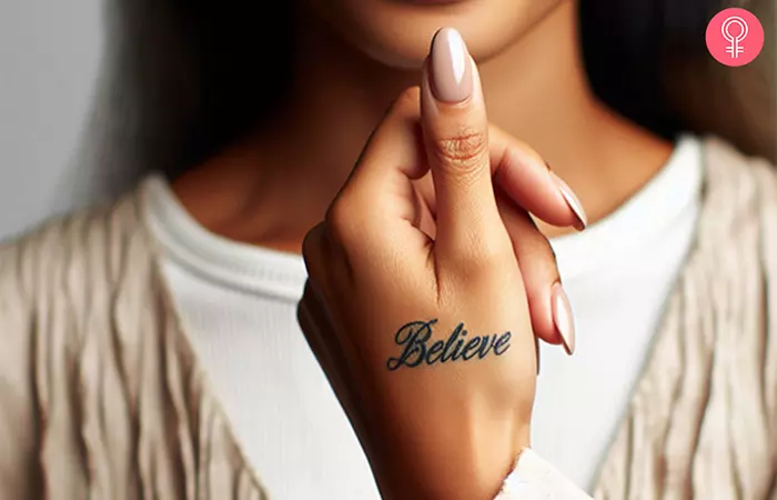 A woman with a tattoo on the side of her thumb