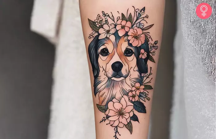 A woman with a traditional dog portrait tattoo on her arm