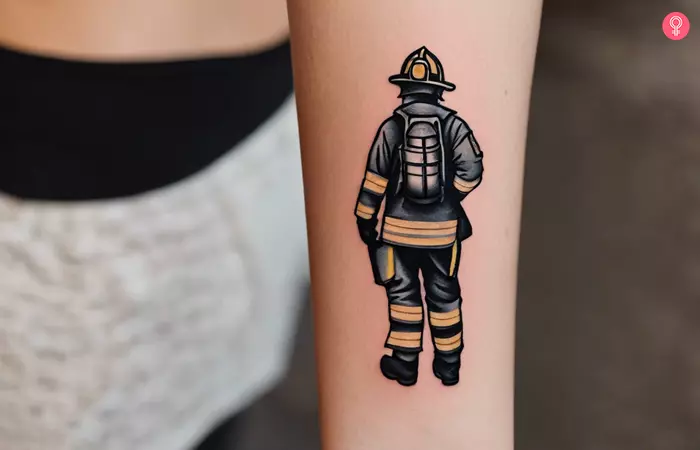 A woman with a traditional firefighter tattoo on her forearm
