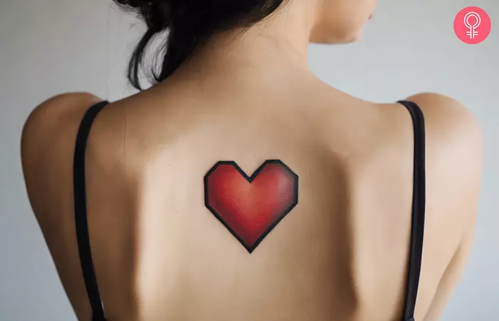 A woman with a video game heart tattoo on her back