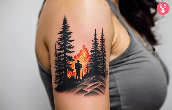 A woman with a wildland firefighter tattoo on her upper arm