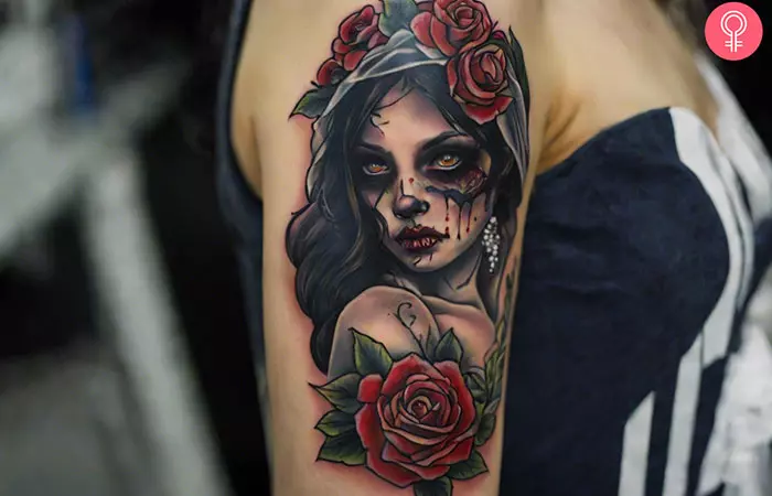 A woman with a zombie bride tattoo design on her upper arm