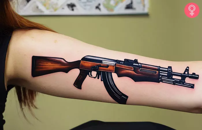 A woman with an AK-47 tattoo on her arm