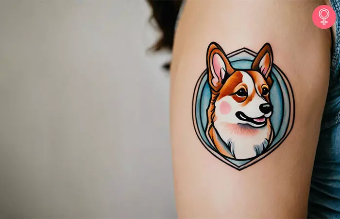 A woman with an American traditional corgi tattoo on her upper arm