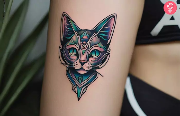 A woman with an alien cat tattoo on her arm