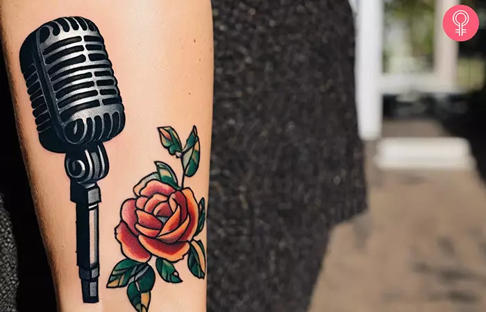 A woman with an old school microphone tattoo on her lower arm