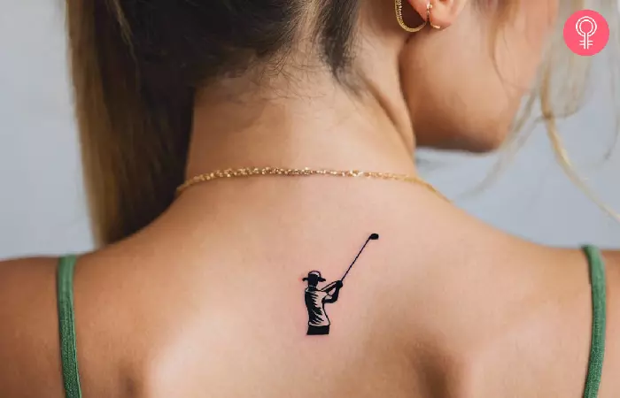 A woman with small golf tattoo on the upper back