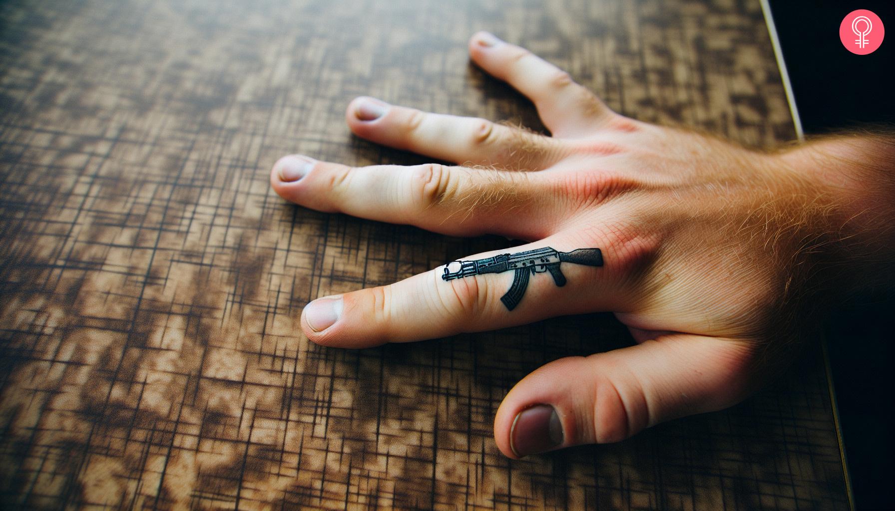 A woman with an AK-47 finger tattoo