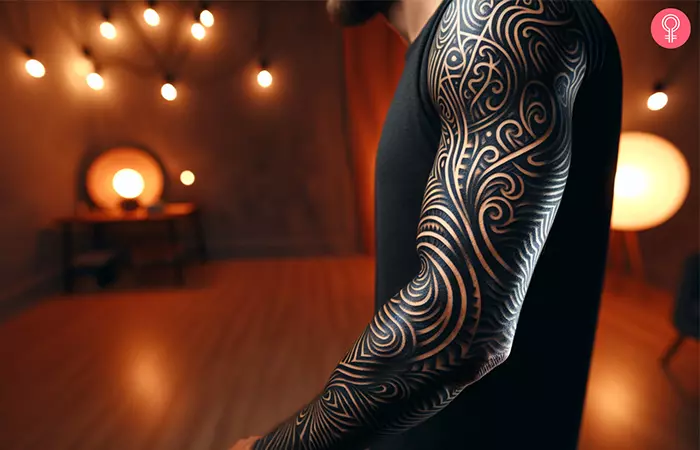 An abstract blackout sleeve tattoo on the arm
