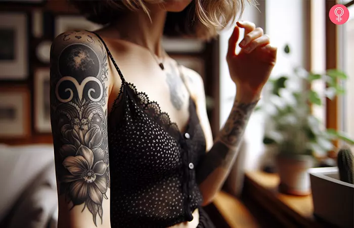 An Aries flower tattoo on the arm of a woman