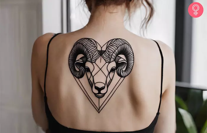 An Aries ram tattoo on the back of a woman