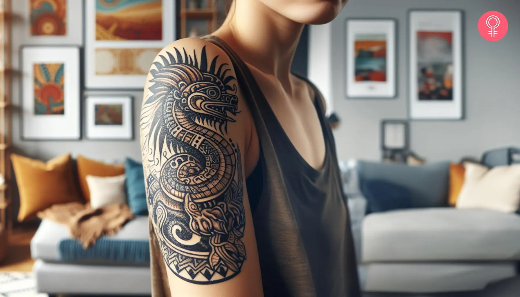 An Aztec dragon tattoo on the upper arm of a woman