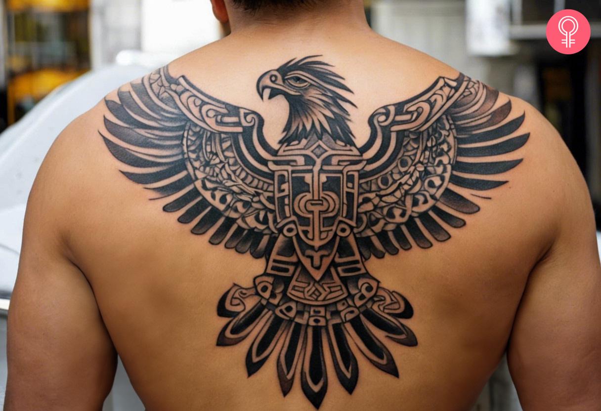 An Aztec eagle tattoo on a man's upper back