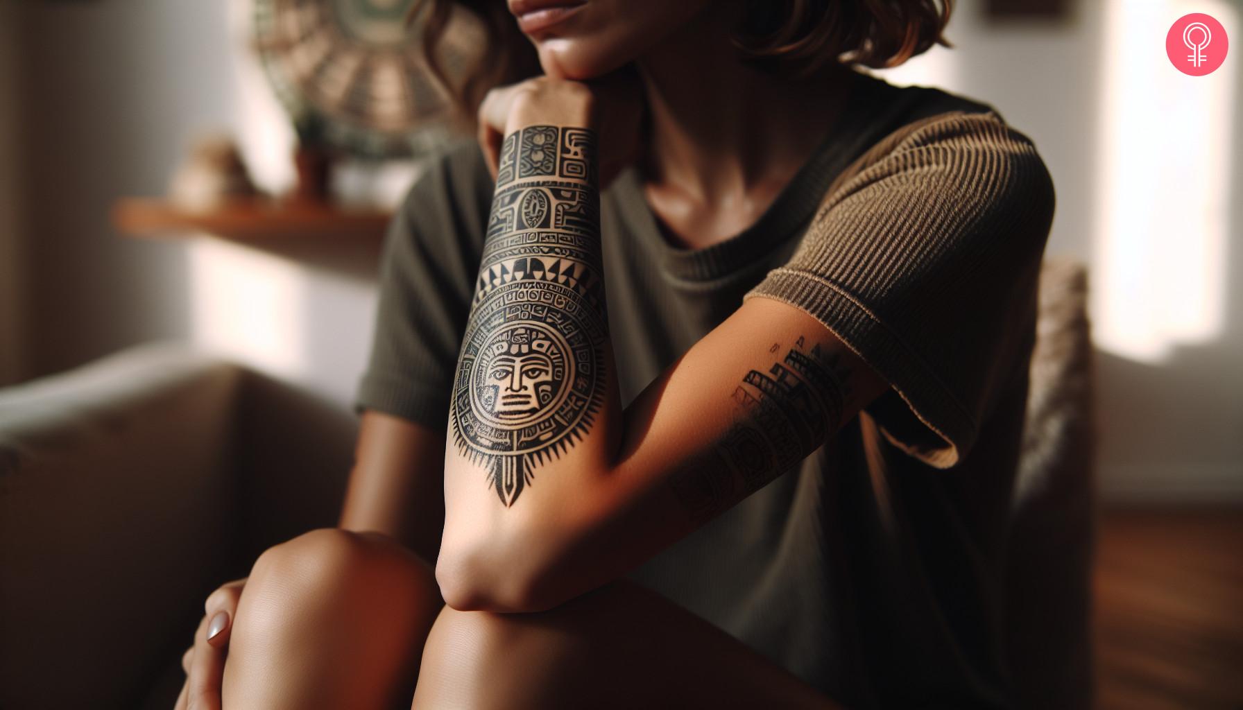 An Aztec tattoo on a woman's forearm