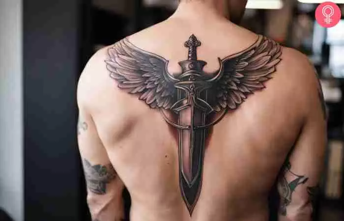 An archangel Michael sword tattoo on the chest of a man