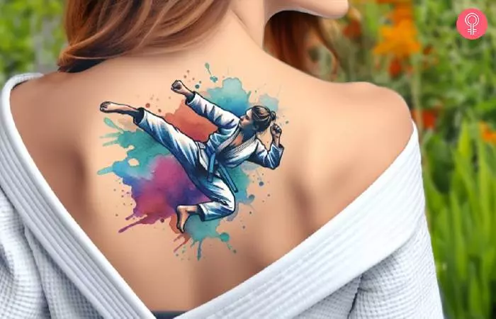 An upper back watercolor jiu jitsu tattoo