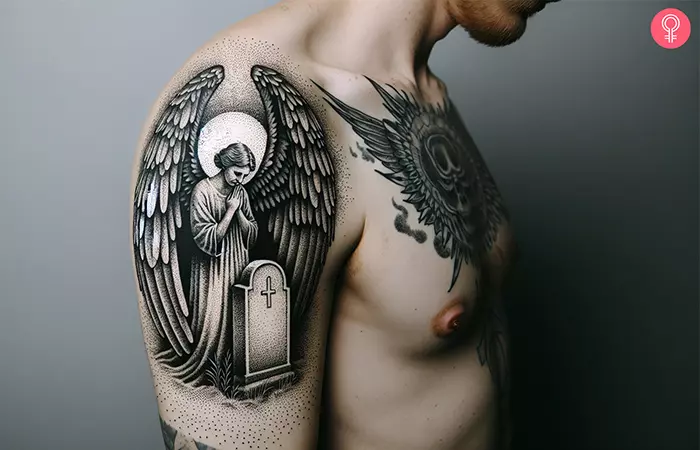 Shoulder tattoo of an angel crying over a tombstone