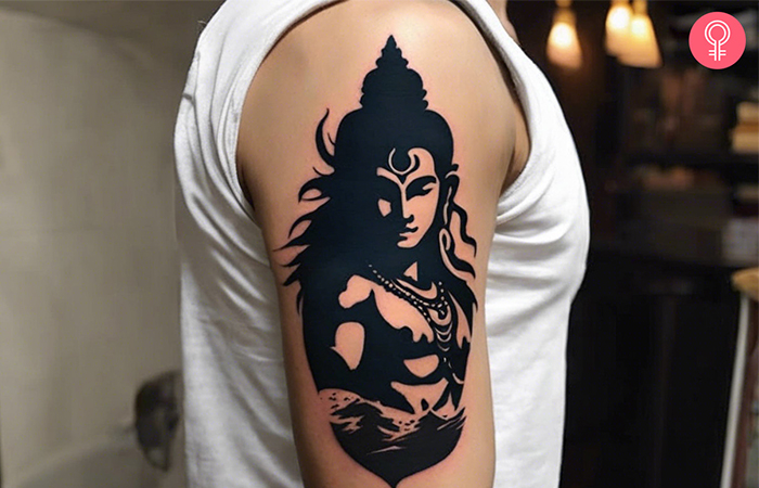 An angry lord Shiva tattoo on a man’s arm