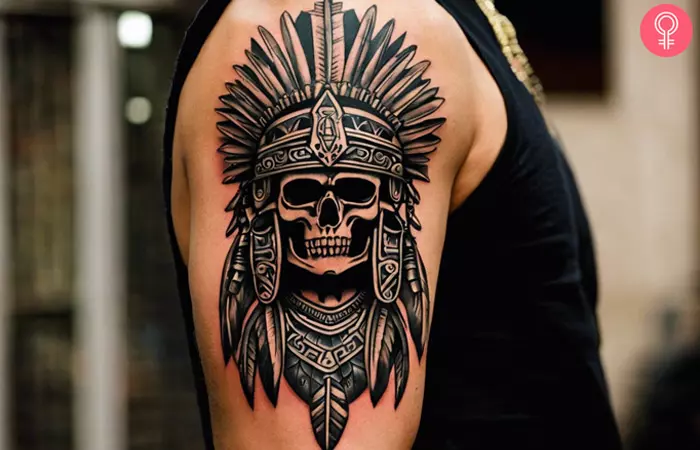 Aztec warrior skull bicep tattoo