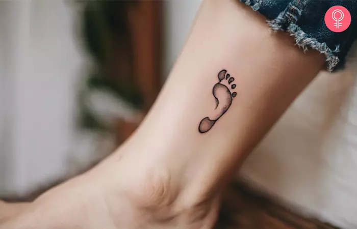A baby footprint tattoo on the foot