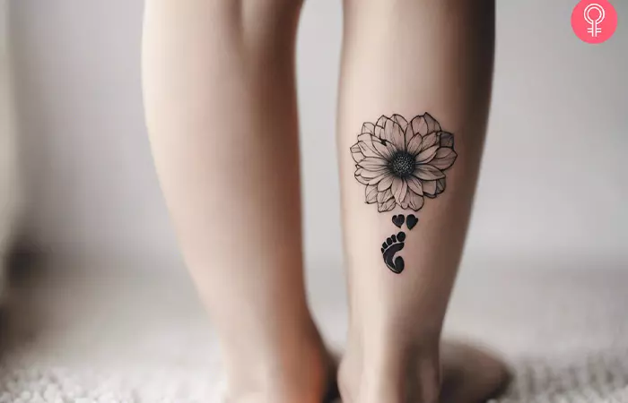 A tattoo of a baby footprint with flowers