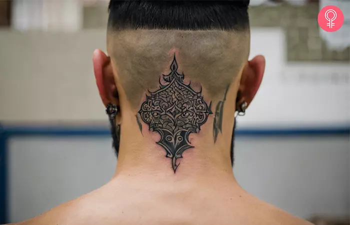 A man with a head tattoo on the back of the head