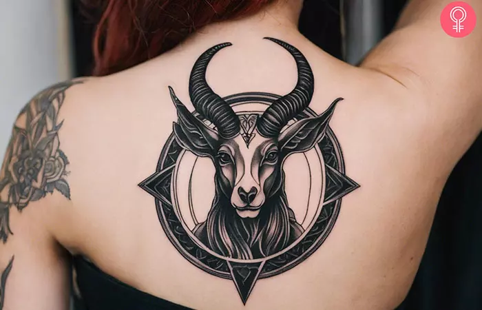 Woman with a Baphomet tattoo on the back