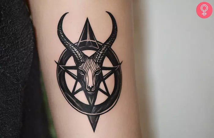 Woman with a Baphomet tattoo on the hand