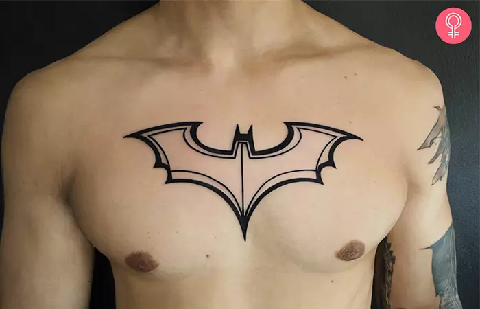  Tattoo of a Batman logo outline on the chest