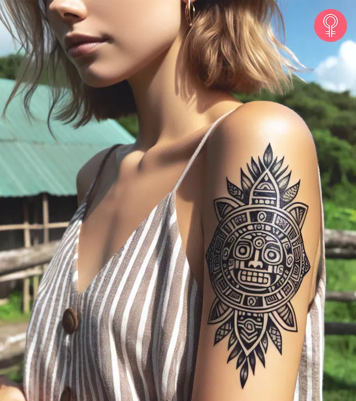 A woman with an Aztec tattoo on her arm